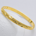 Thin filigree gold bangle bracelet